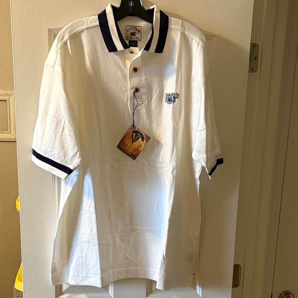 Cutter & Buck NWT “Bad Water Railway” White and Navy Blue Polo size XL.‎